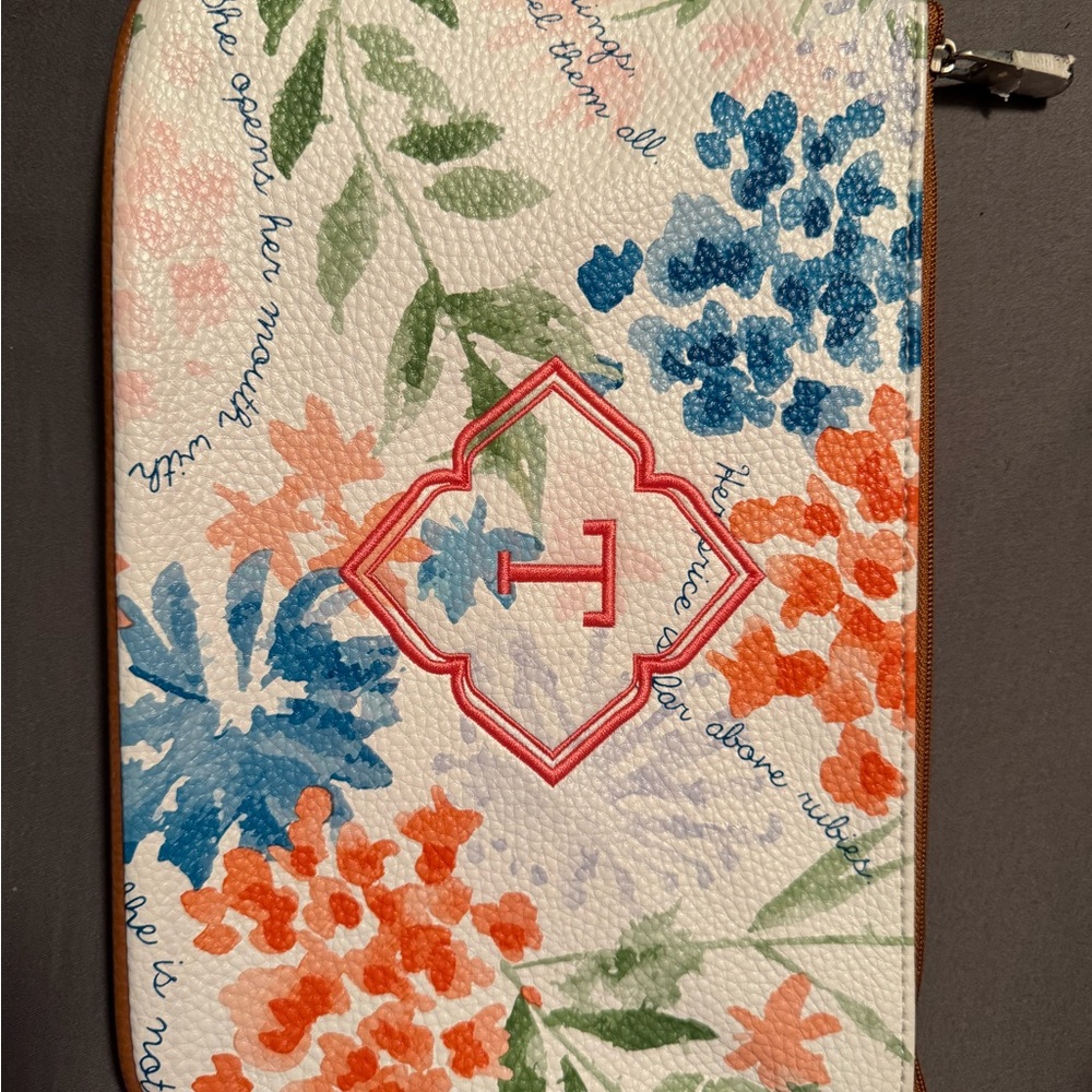 Floral Patterned leather wristlet  with coral monogram “T”